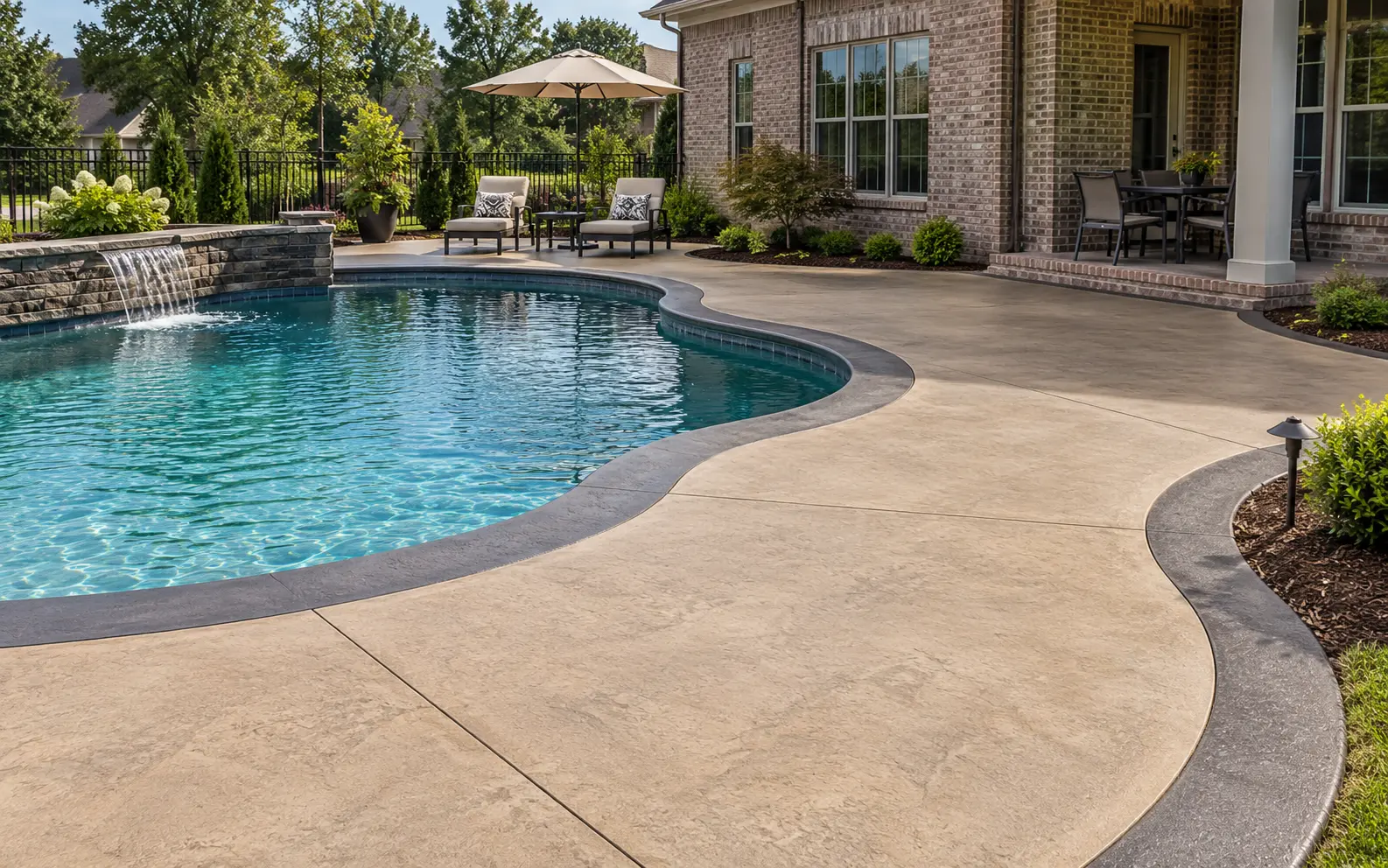 Colored poured-concrete pool deck with contrasting border