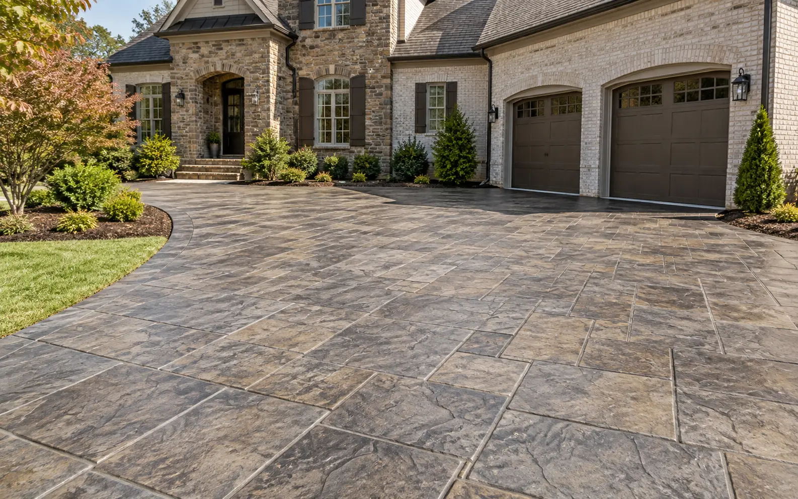 Decorative stamped concrete driveway at a Milton-style home